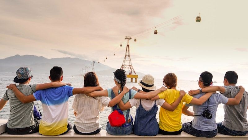 A group of friends with arms around each other